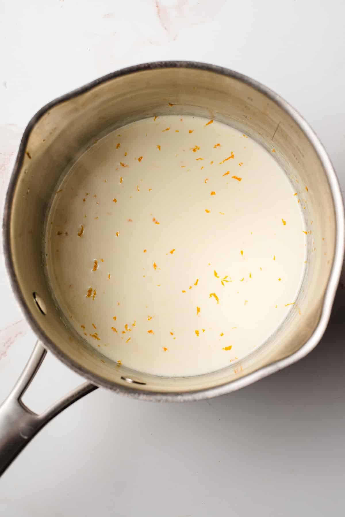 heavy cream and orange zest in a saucepan