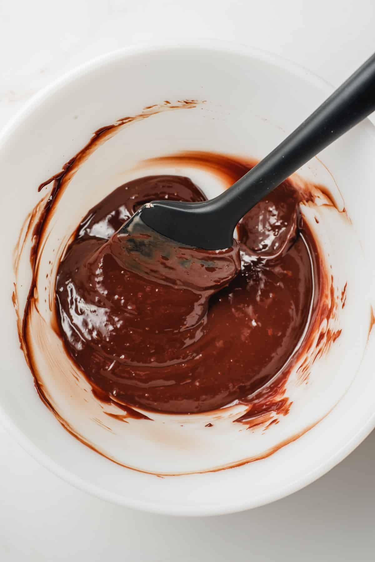 ganache ingredients combined in a white bowl