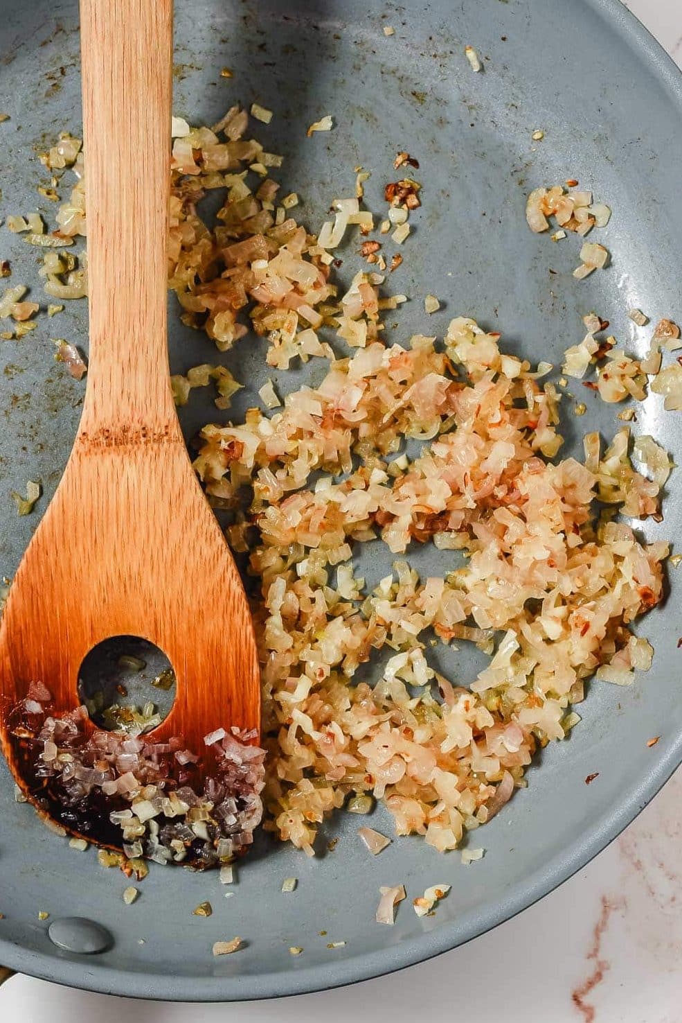 Shallot sauteed in butter in a frying pan