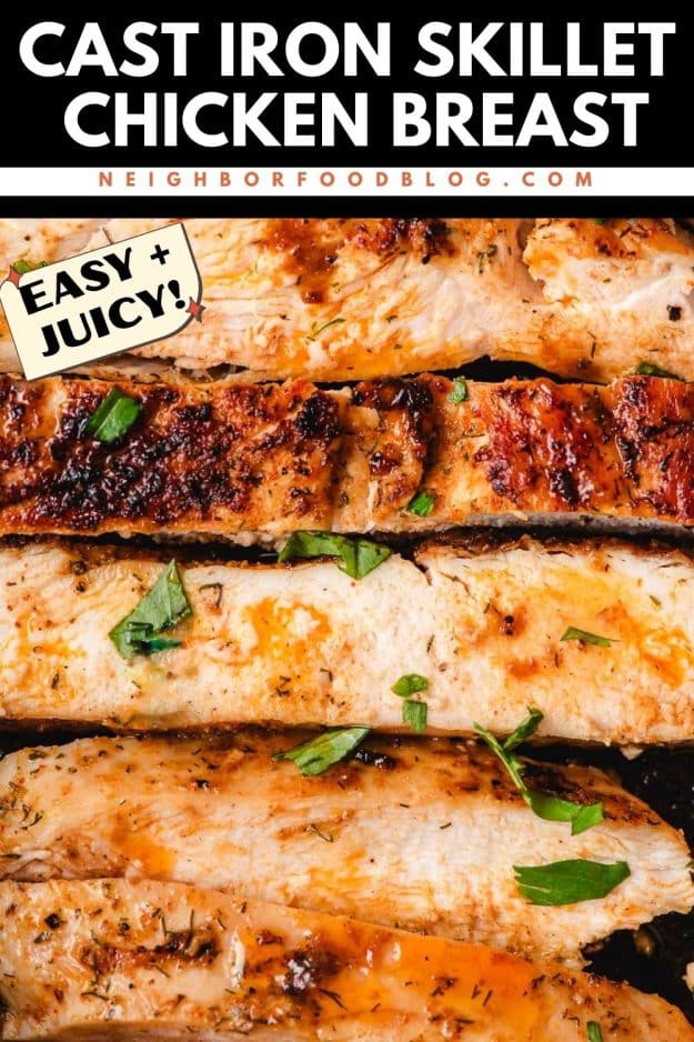 Slices of chicken breast lined up and topped with fresh herbs.