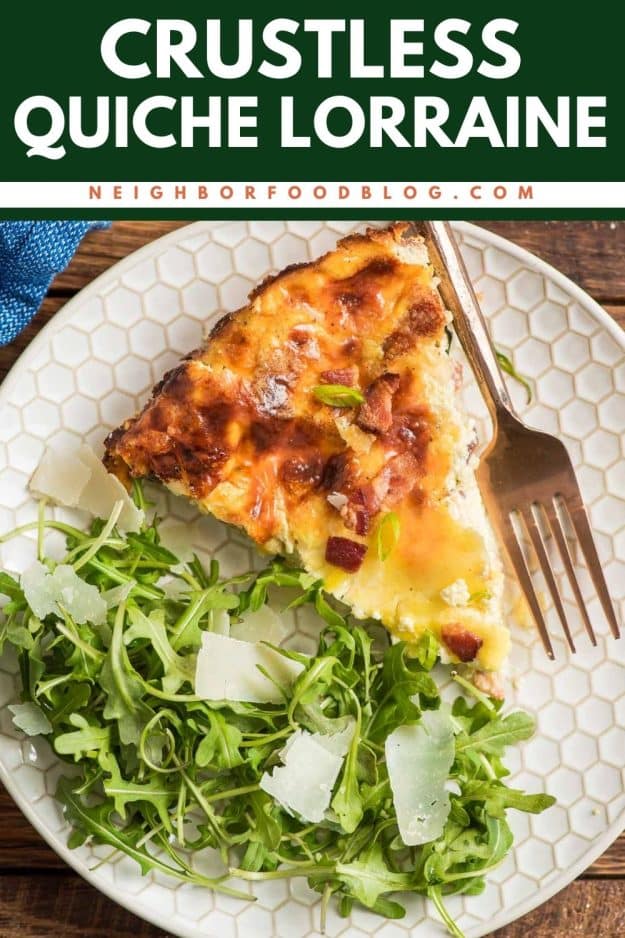 Slice of crustless quiche on a plate beside an arugula salad.