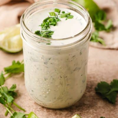 Mason jar filled with creamy cilantro ranch dressing.