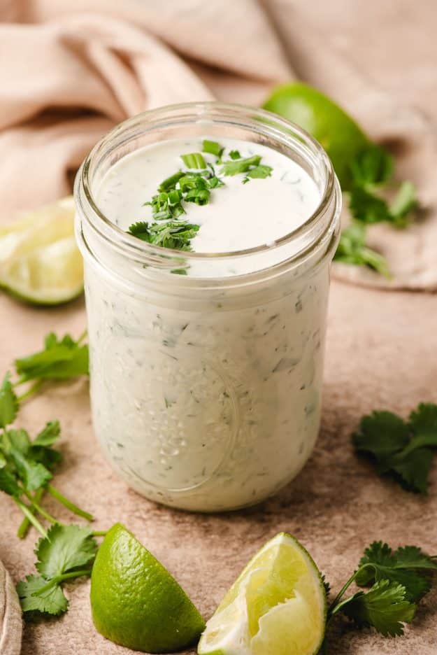 Mason jar filled with creamy cilantro ranch dressing.